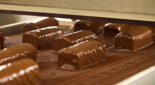 Cocoa butter equivalent for enrobing improving chocolate flow