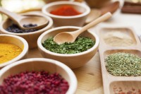 Various spices in a wooden bowl