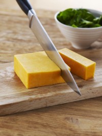 Cheddar on cutting board