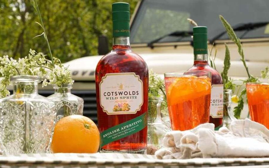 Bottle of Cotswolds Wild Spritz photographed outdoors with botanical styling, showcasing the new English aperitivo.