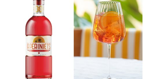 A bottle of red Aperiniets aperitif is on the left, and a glass with orange spritz, ice, and an orange slice on the right.