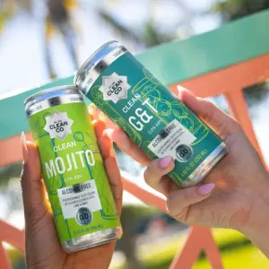 CleanCo ready‑to‑drink non‑alcoholic cocktails displayed in cans.