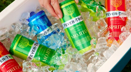 Cans of Fever-Tree beverages (Mojito, Spritz, etc.) sitting in ice in a cooler