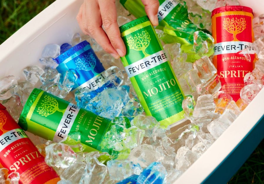 Cans of Fever-Tree beverages (Mojito, Spritz, etc.) sitting in ice in a cooler